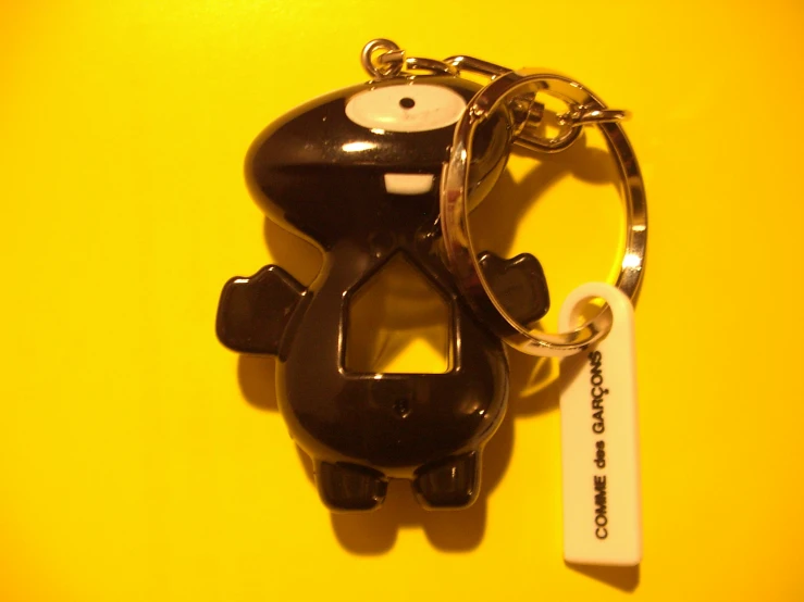 a key chain with a black and white cartoon character on it