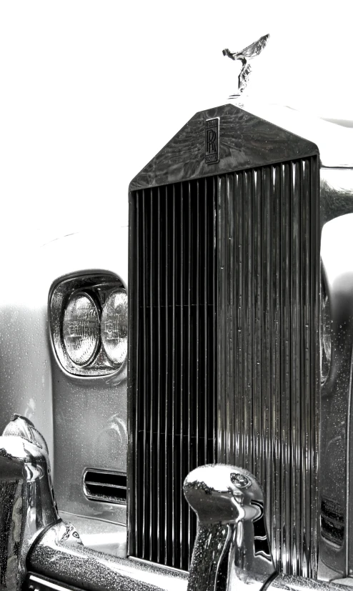 the emblem of an old model car in black and white