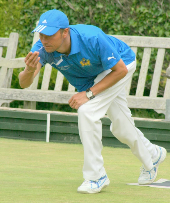 man catching a ball with his foot while playing