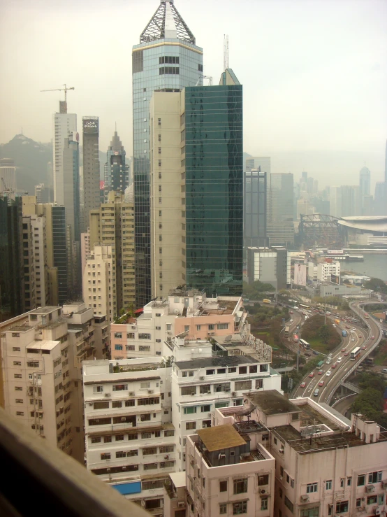 large white buildings and some city buildings in the distance