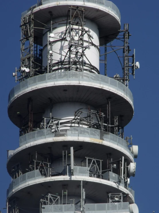 an observation tower with large pipes and lights in the front