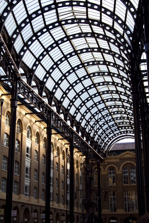 the building has glass arches and arched windows