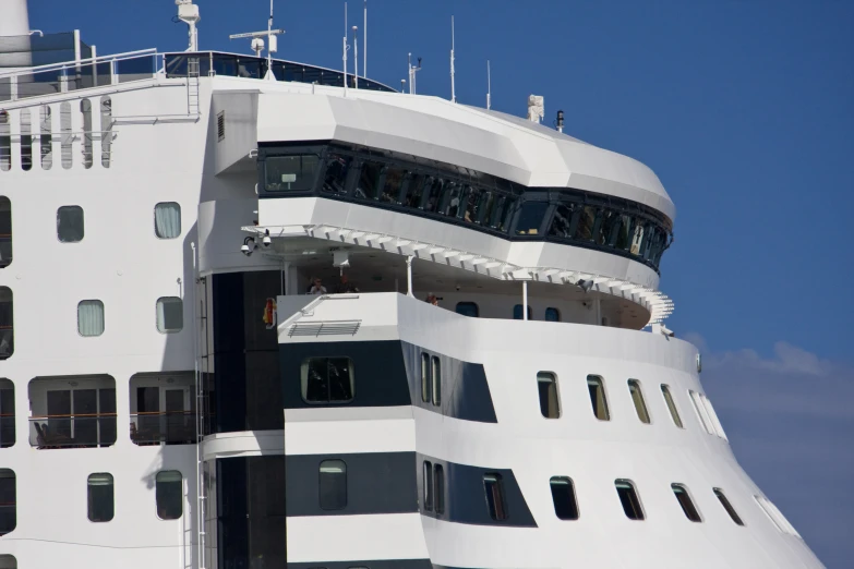 a cruise ship that is white and has black details