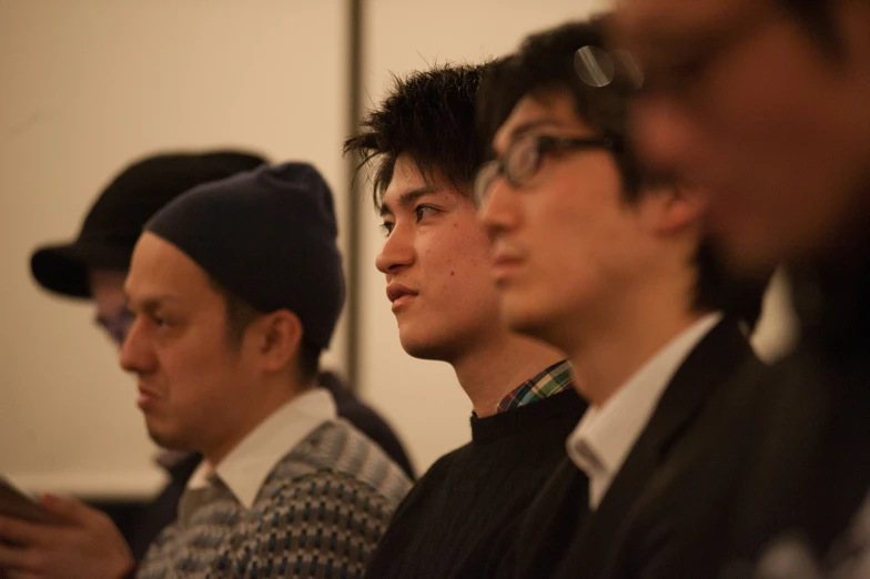 men looking off into the distance during a meeting