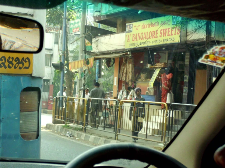 an indian restaurant, with a bunch of people standing outside