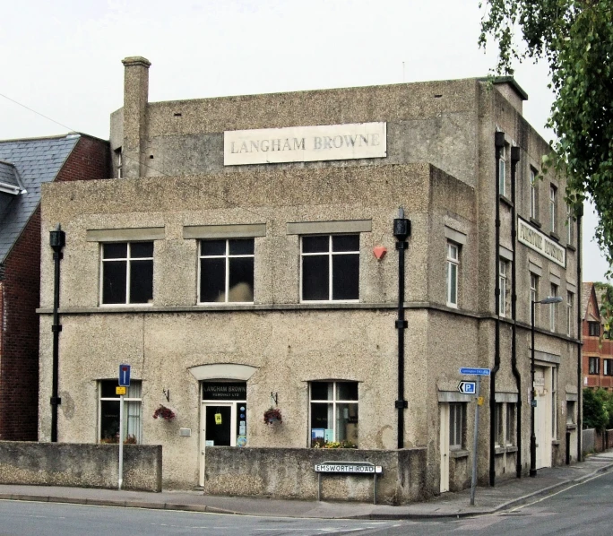 an old looking building with some signs on the front of it