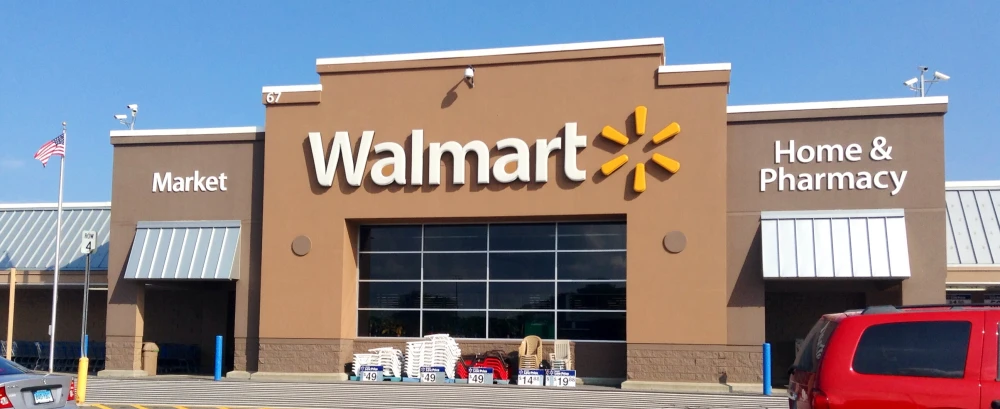 the front of a walmart store with its cars parked in front of it