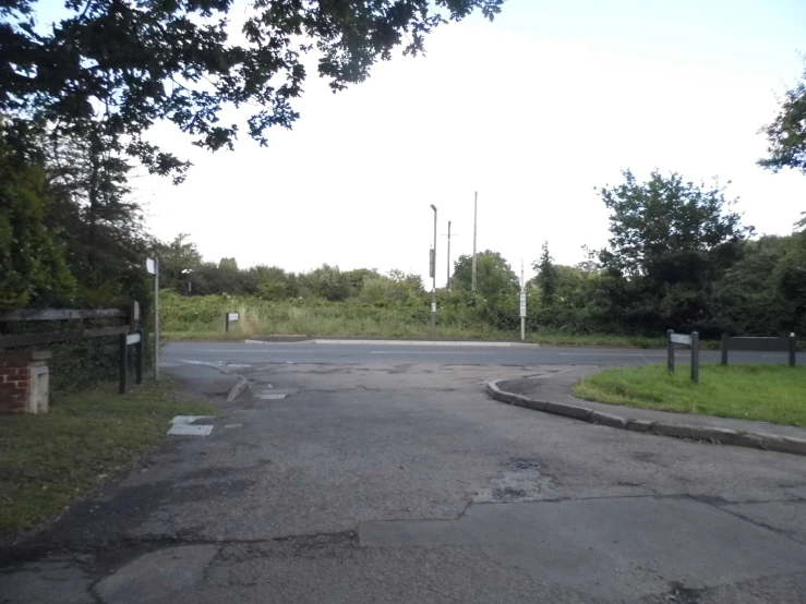 a street sign sitting in the middle of a paved street