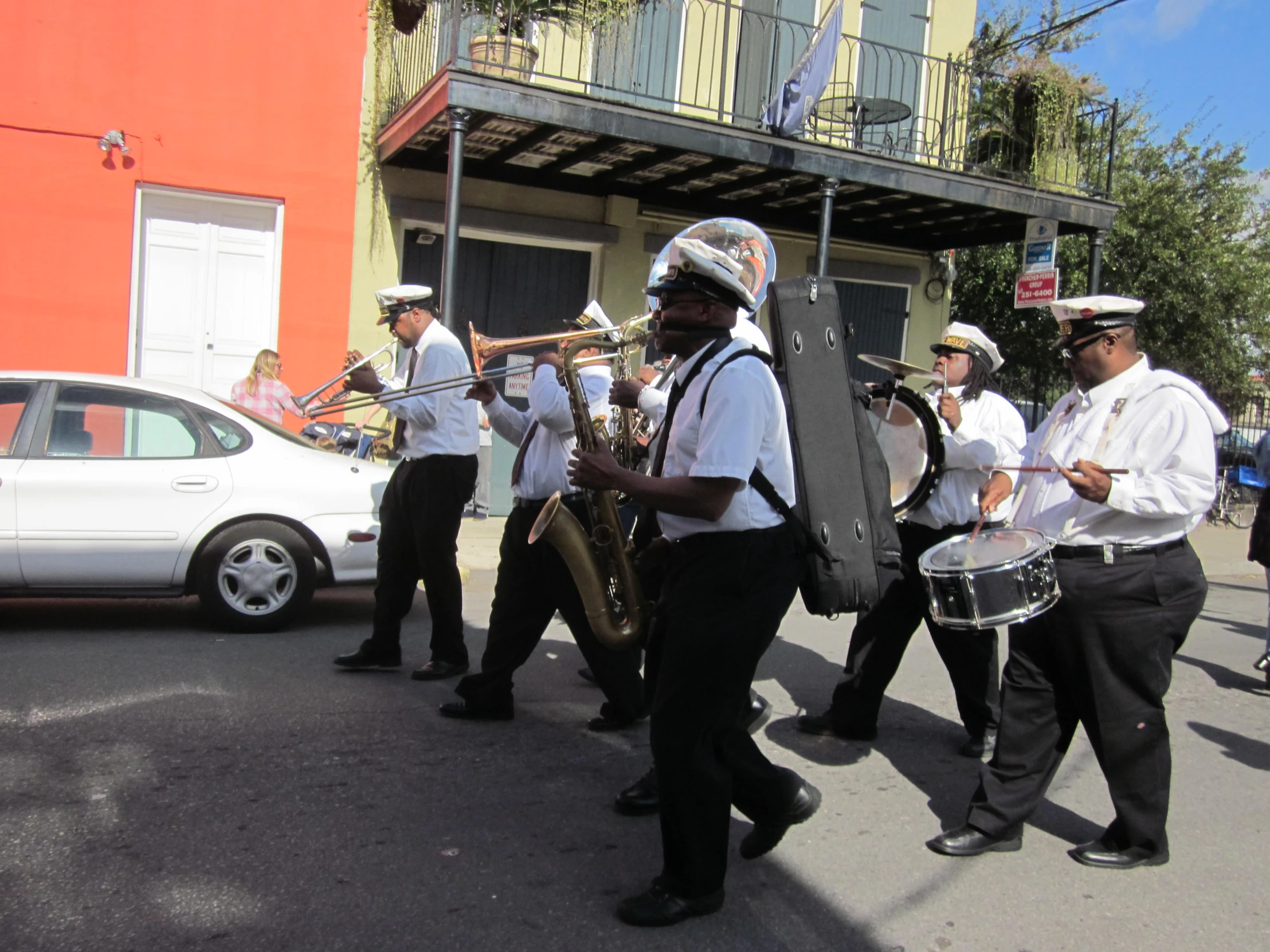 the men are playing musical in the street