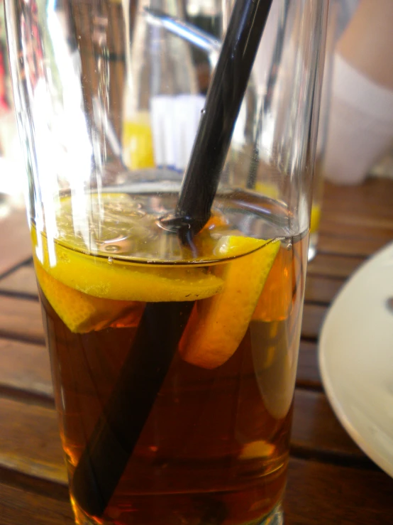 a glass of drink with a straw in it on a table