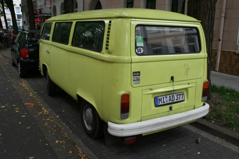 a green van parked on the side of the street