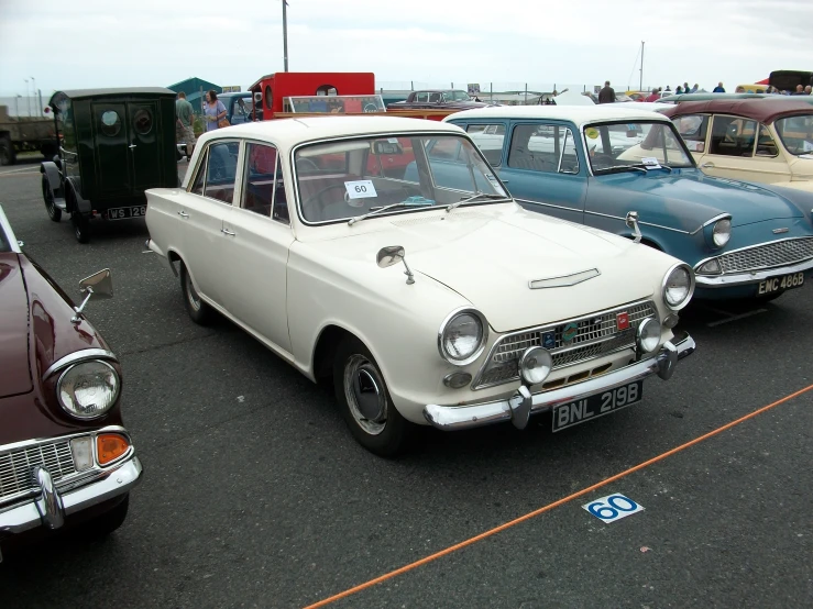 old cars are parked in a parking lot