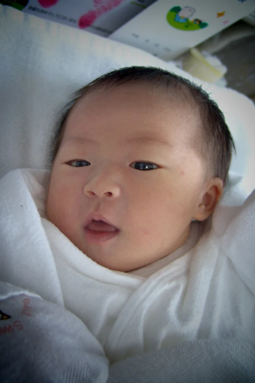 a baby that is laying down in a crib