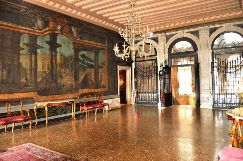 an elaborate dining hall with chairs and art on the walls