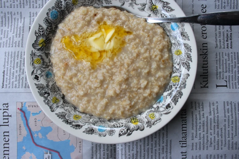 there is a white plate with oatmeal on it