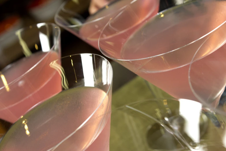 pink cocktails with beverage glasses on top