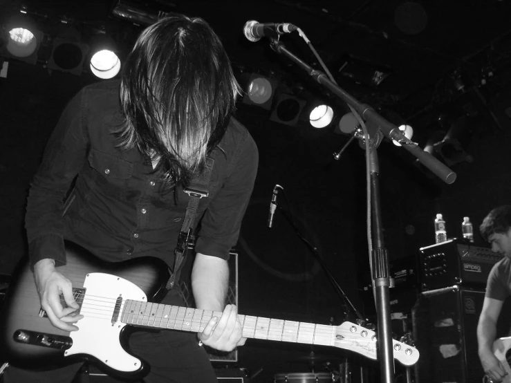 a man playing a guitar and other music instruments