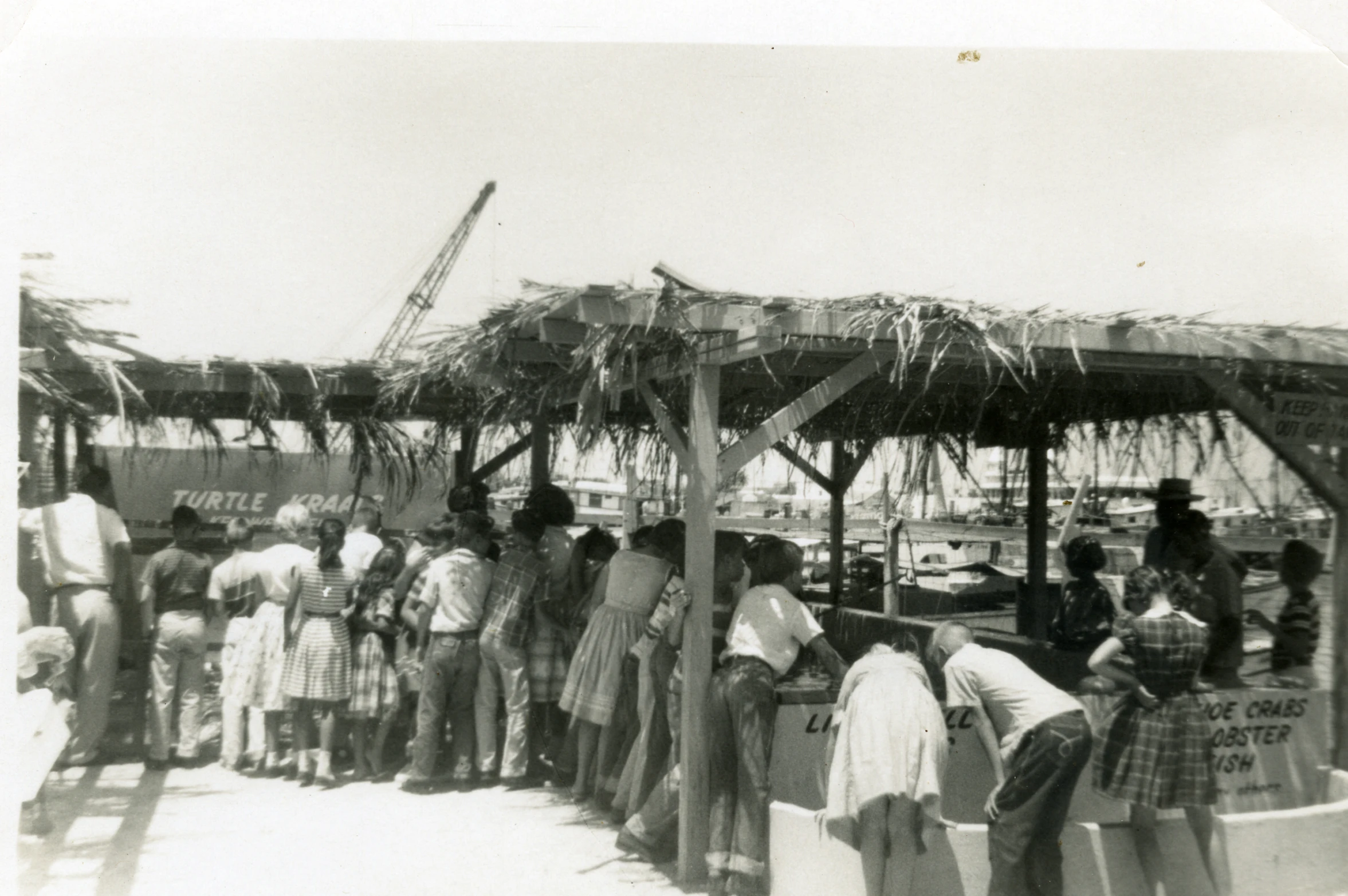 a group of people standing around each other