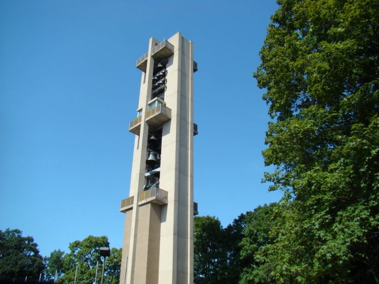 a tall clock tower with a metal balcony