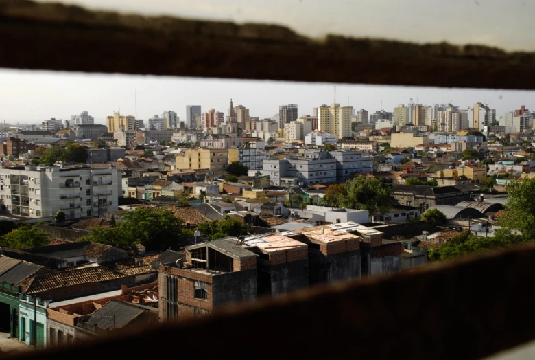 a city with buildings as seen through a window