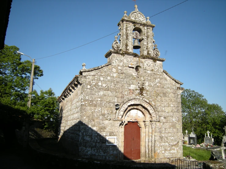 a large building with a steeple with clocks on it