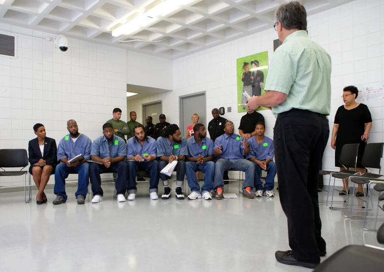 people are lined up and waiting in a waiting room