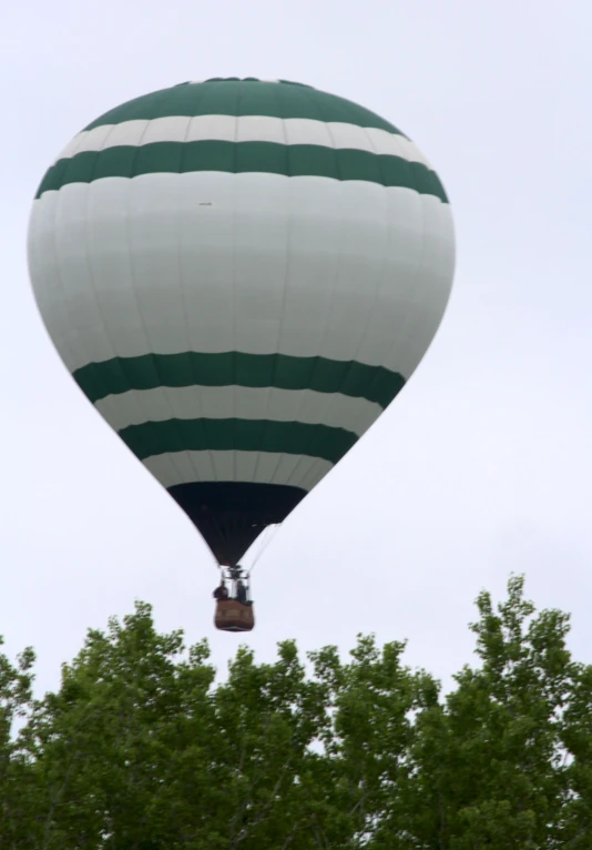 a large balloon is flying in the sky