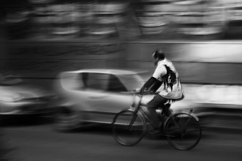 an image of a man riding a bike