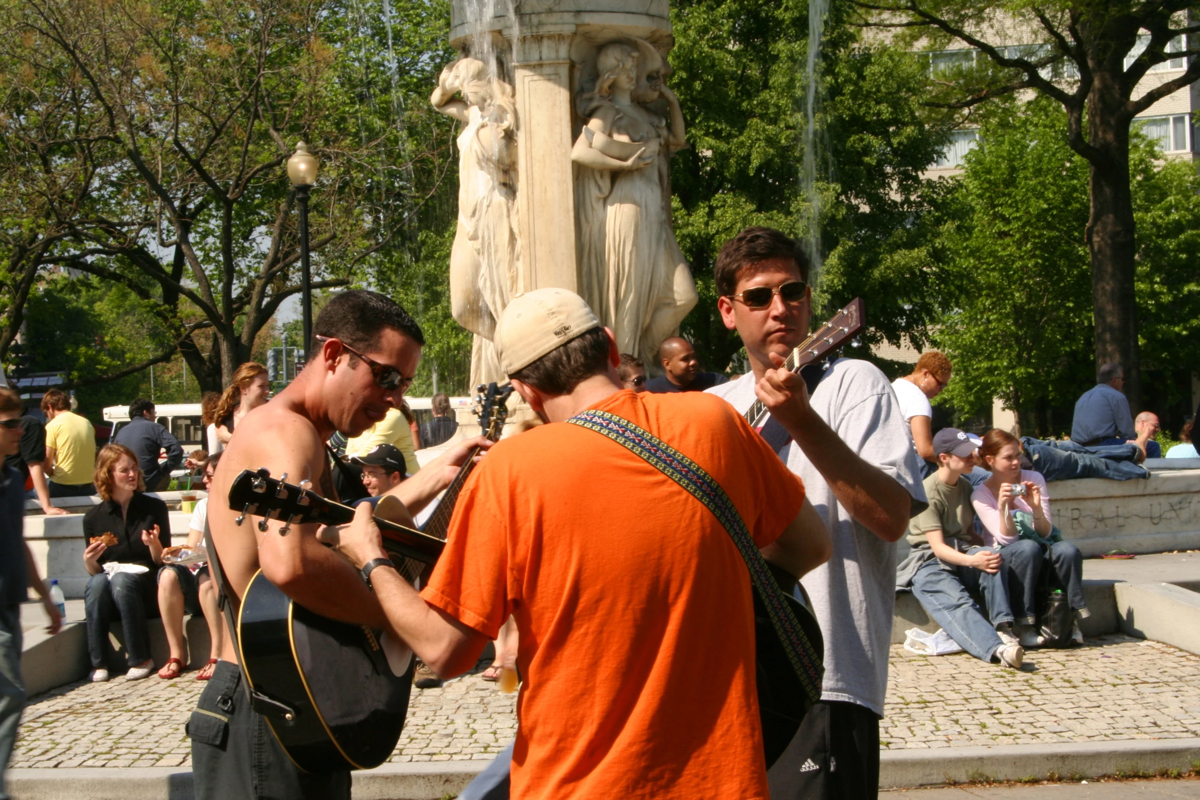 a group of young people in a park on a sunny day