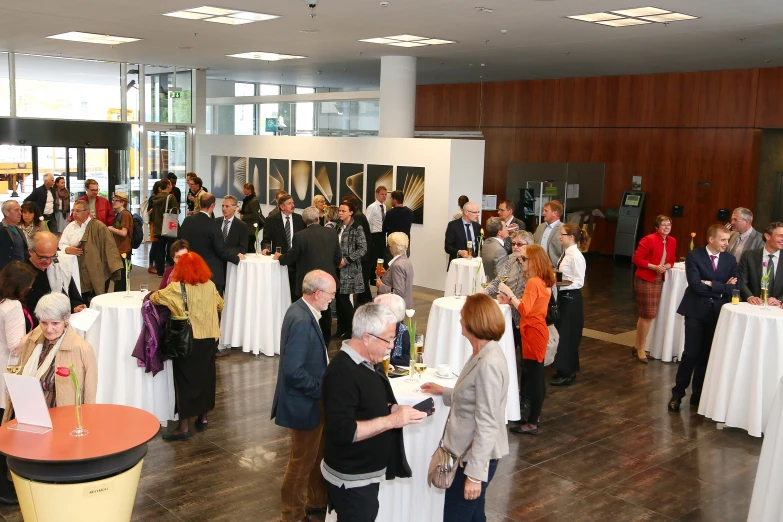 people are gathering inside a large building for a formal function