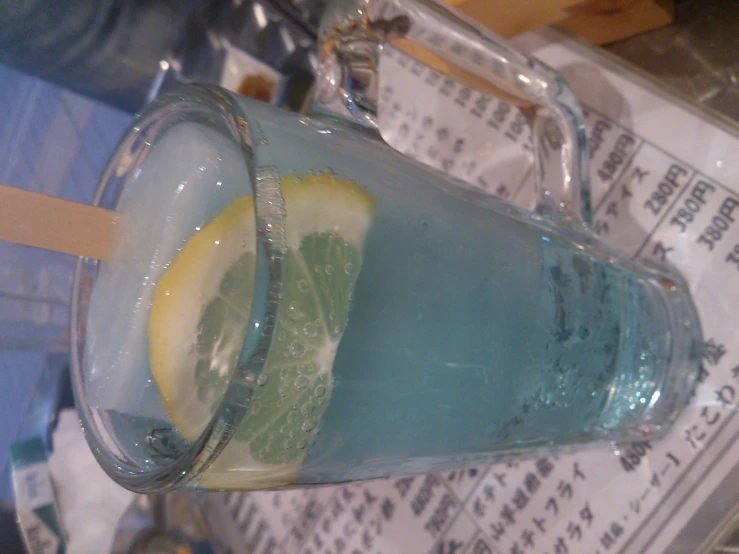 a pitcher of water with lemon and mint