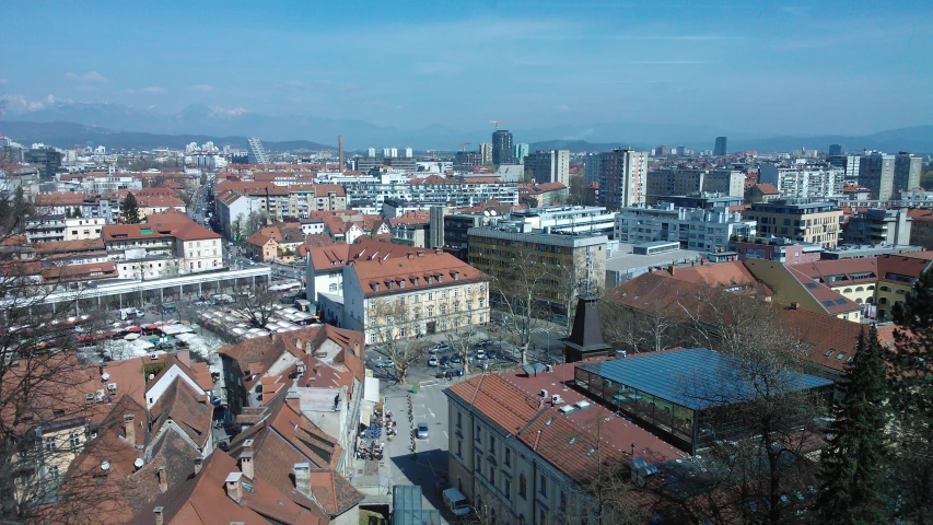 an aerial view of city with red roofs