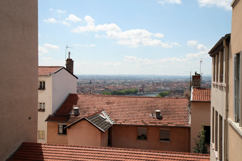 rooftops in urban setting with an ocean view