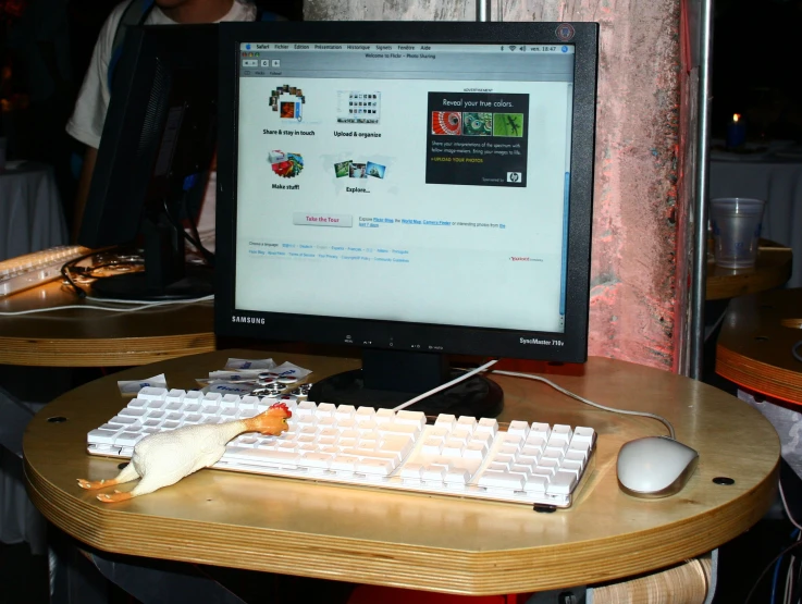 a mouse, keyboard and mouse pad sit on a table