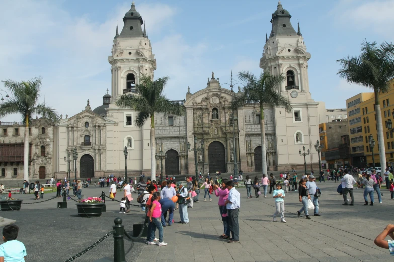 there is a crowd of people walking around a square