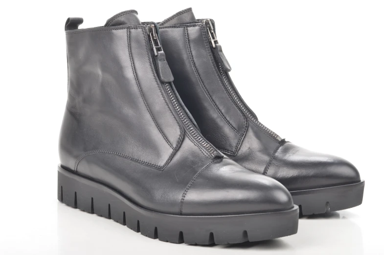 the sole zip boots in black are lined up