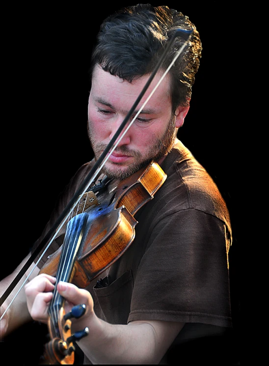 a man that is playing the violin and has a dark background