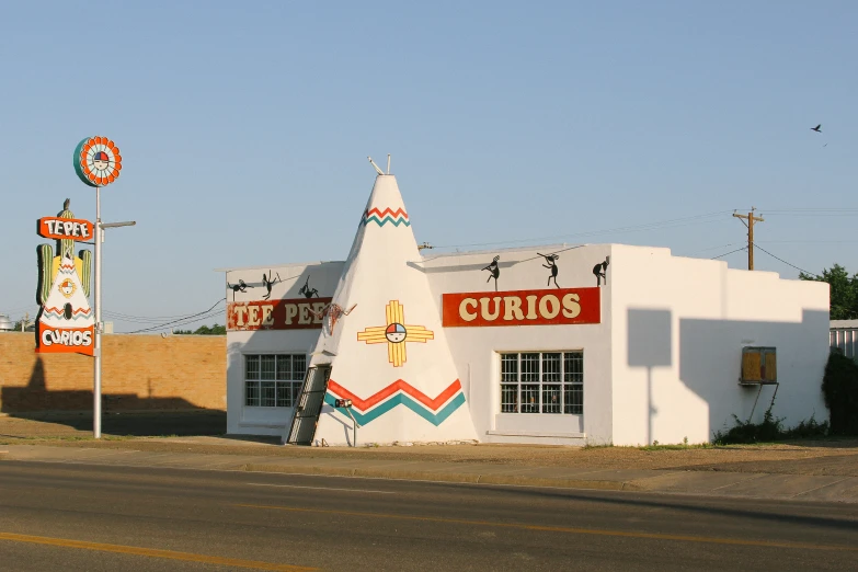 a building on a street that has signs on the side