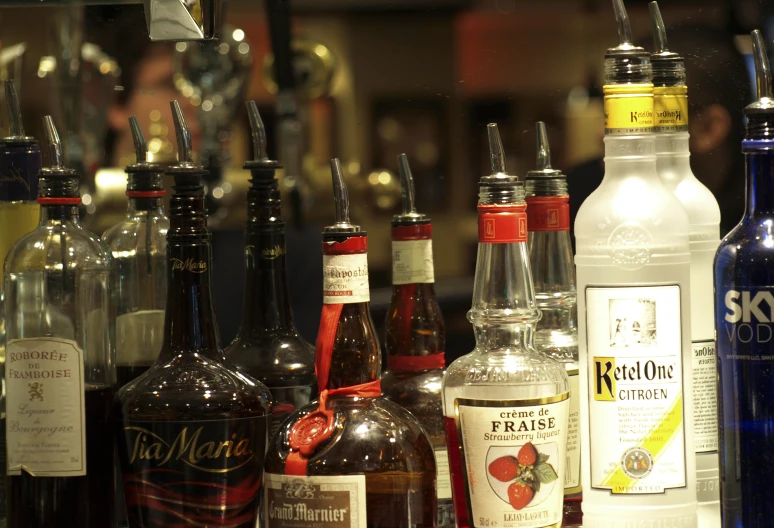 several different types of alcohol are on display in bottles