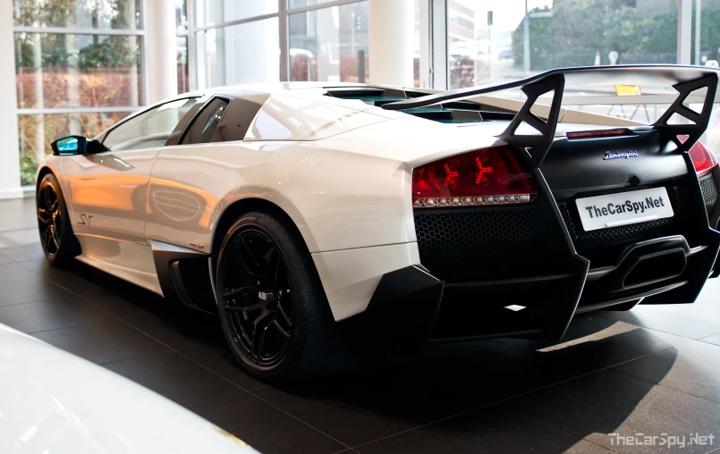 a sports car is shown sitting in a showroom