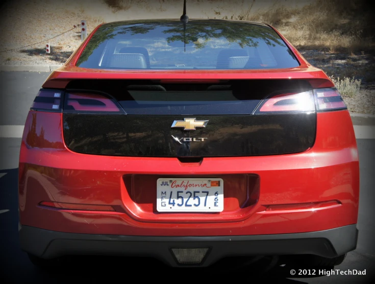 this is a front view of a red chevrolet volv on the side