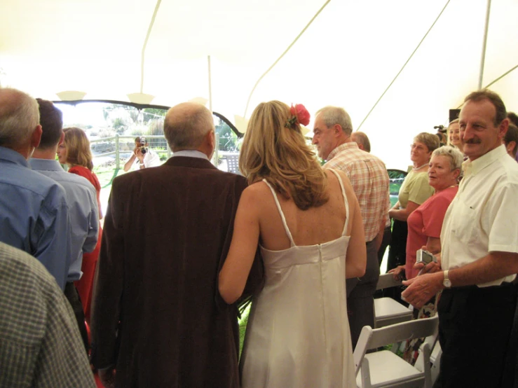 a group of people that are standing under some kind of tent