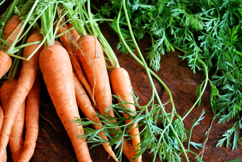 there are many carrots gathered together on the table