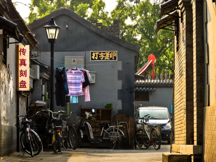 many bicycles in front of a shop on a city street