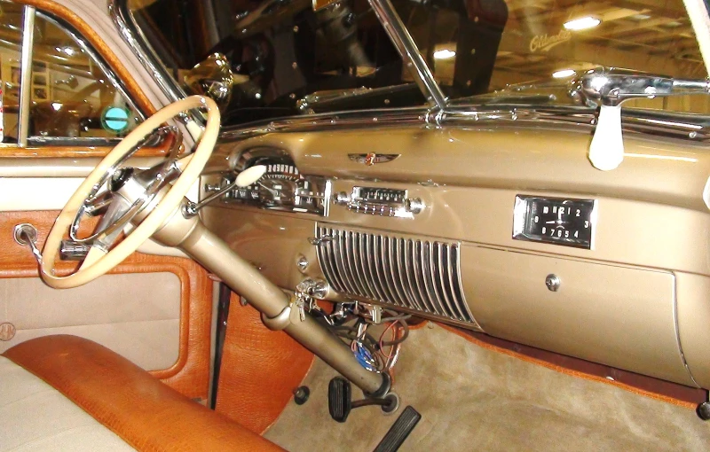 an old model car with dashboard and front seat