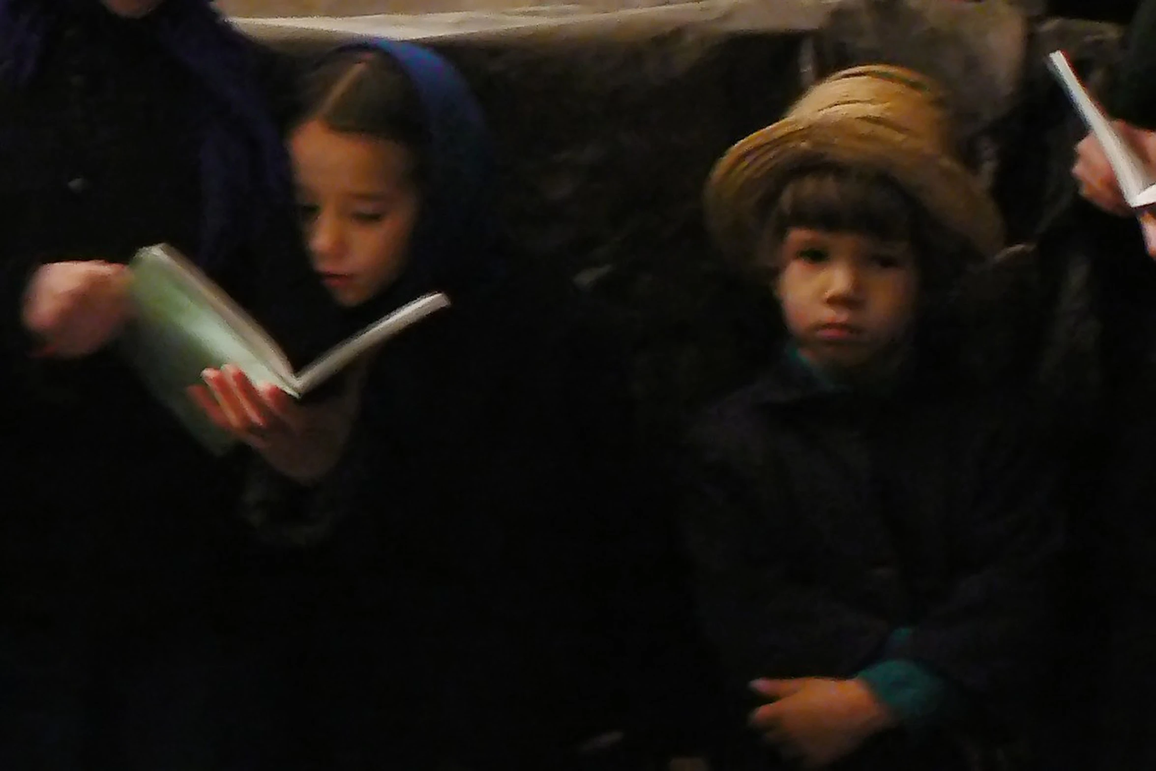 children stand in line to read and write