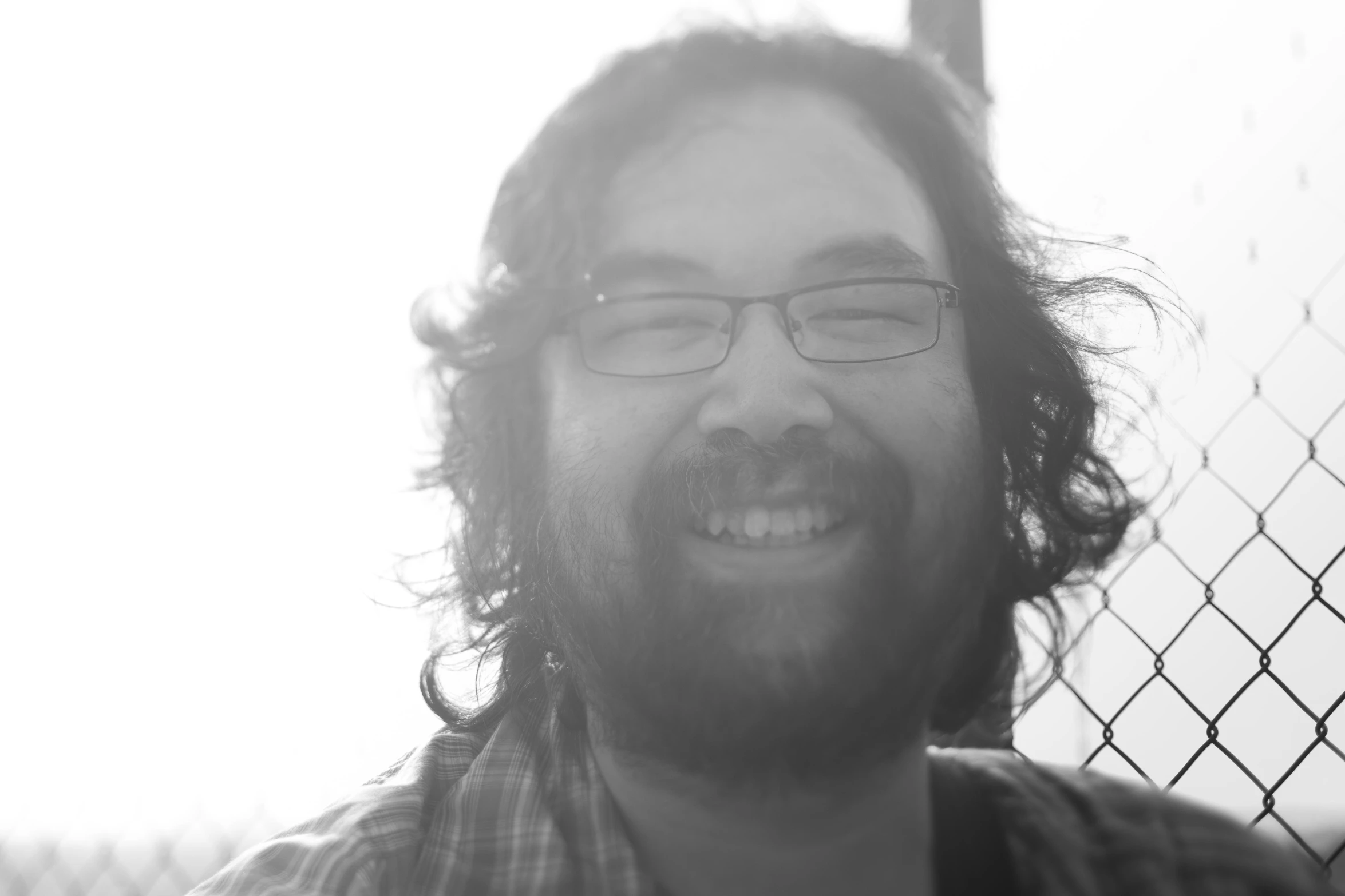 a black and white po of a guy smiling