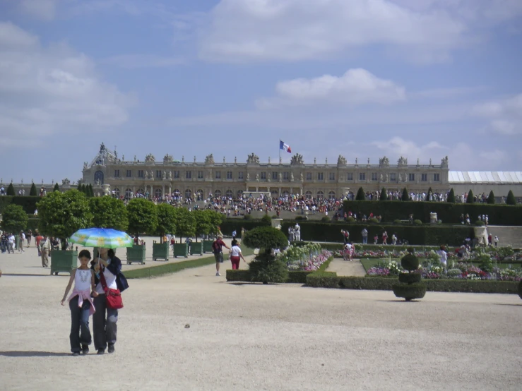 a large building that has people standing around