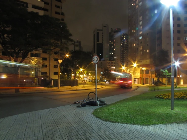 the city street is lit up at night