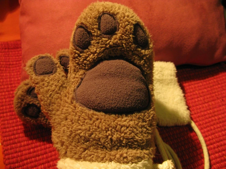 a foot wearing a furry bear animal paw